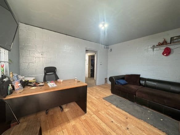 Interior view of an office space featuring furniture and decor, showcasing durable Cordura RE fabric used in furniture upholstery for enhanced longevity and style.