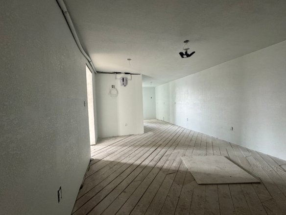 Interior view of a modern, unfinished room showcasing the use of Cordura RE fabric for durable, high-performance outdoor gear and clothing applications.