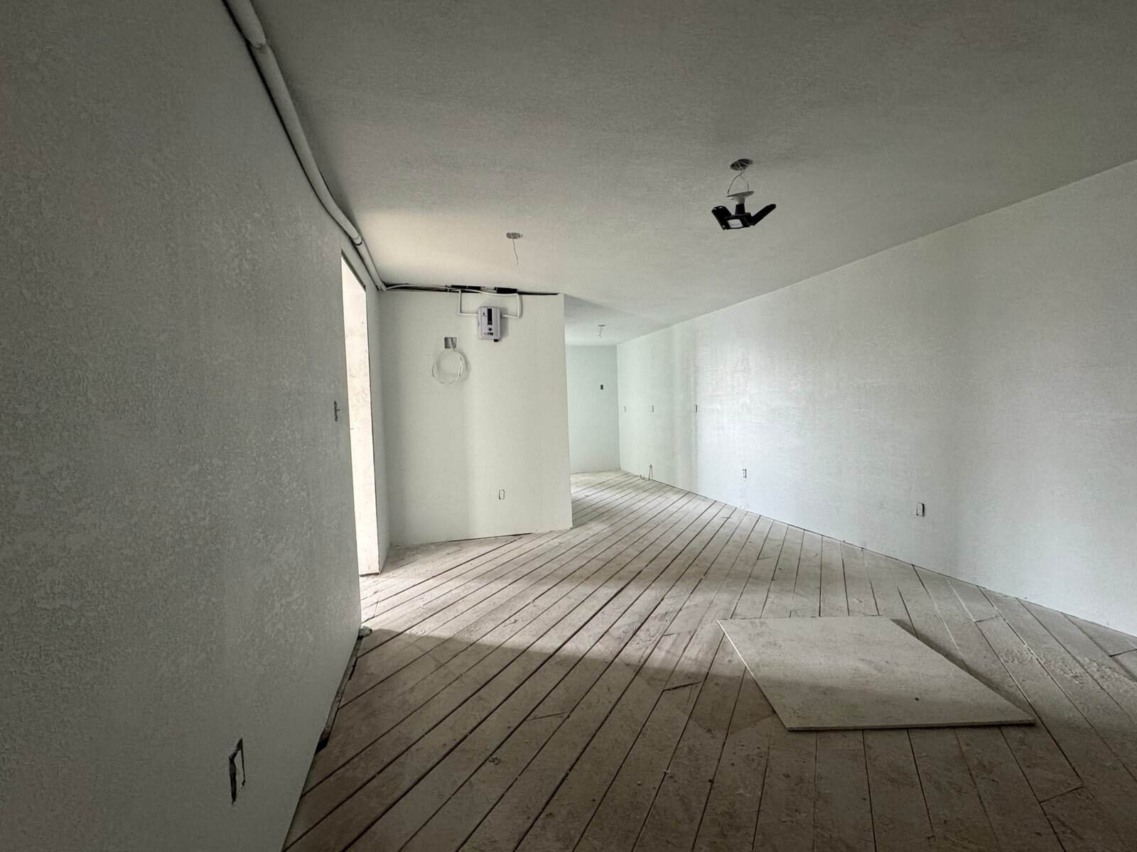 Interior view of a modern, unfinished room showcasing the use of Cordura RE fabric for durable, high-performance outdoor gear and clothing applications.