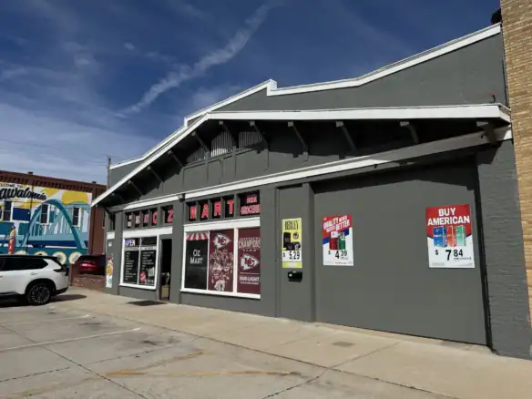Exterior view of a commercial building featuring Cordura RE fabric used in the facade, showcasing its durability and modern design in an urban retail setting.