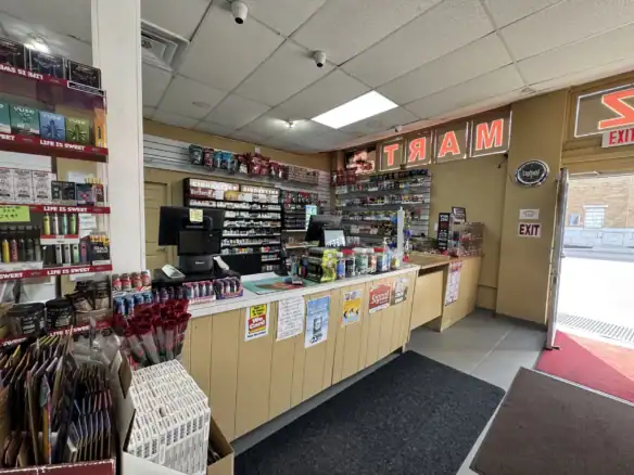 Interior view of a retail store showcasing Cordura RE fabric products, with shelves stocked with various colors and types of durable fabrics, including military and outdoor textiles.