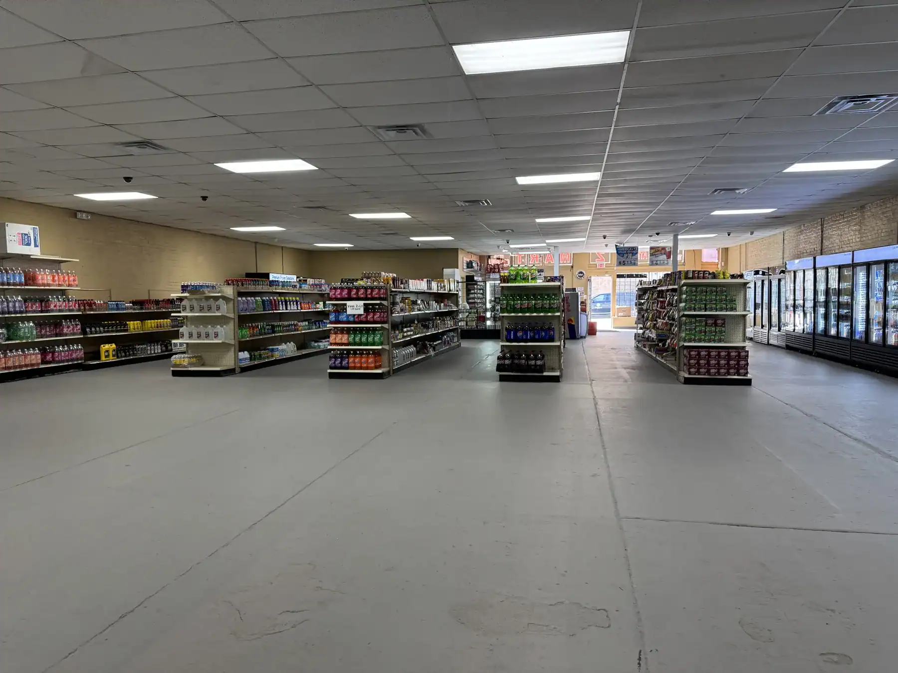 Interior view of a retail store showcasing shelves stocked with various products, highlighting the durability and versatility of Cordura RE fabric used in packaging and displays.