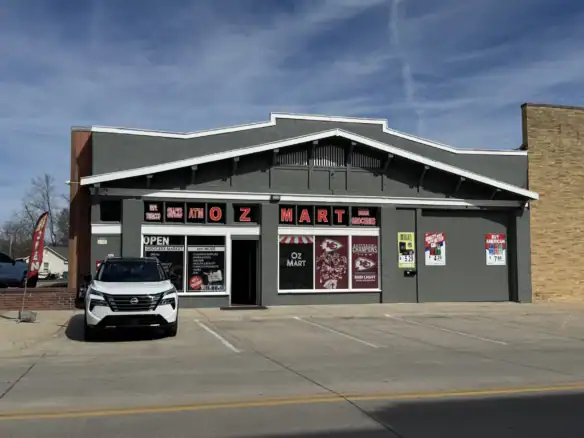 Exterior view of a Cordura RE fabric store with signage, parking lot, and a white vehicle in front, showcasing the retail location for durable outdoor and tactical fabrics.