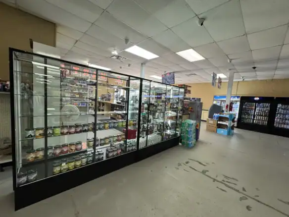 Display case showcasing products made with Cordura RE fabric in a retail store environment, highlighting durability and versatility of the material.