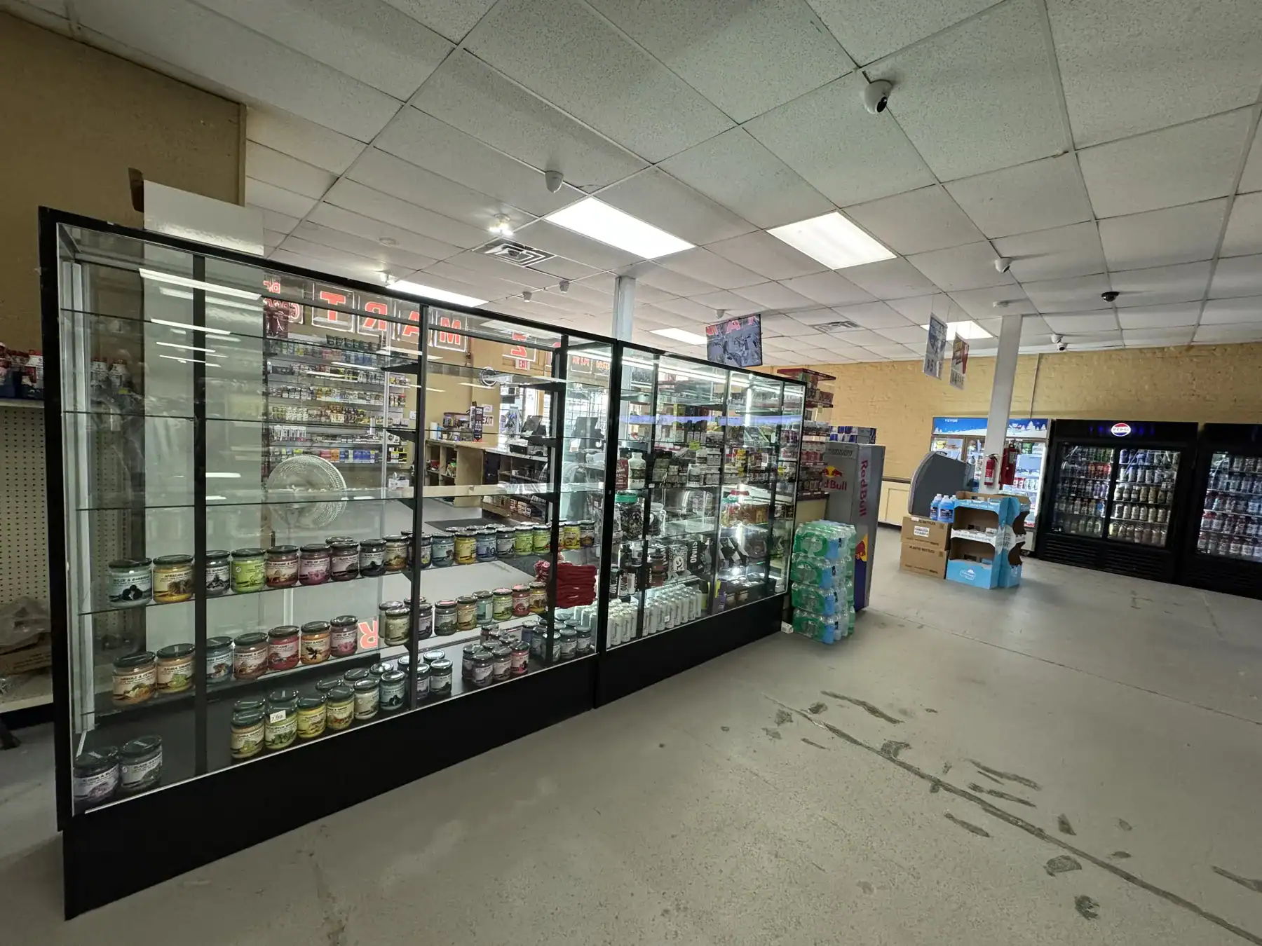 Display case showcasing products made with Cordura RE fabric in a retail store environment, highlighting durability and versatility of the material.