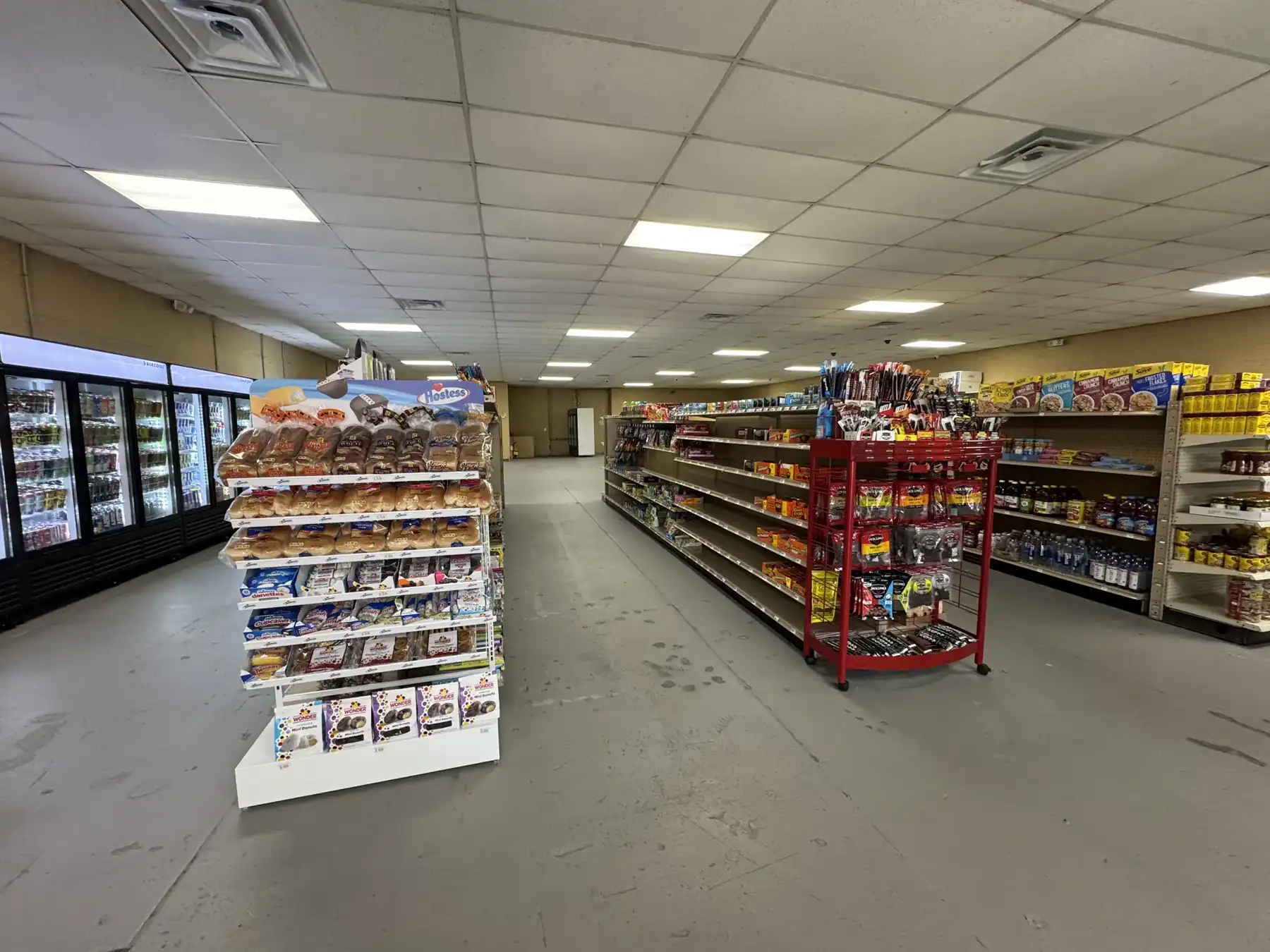 Retail store aisle showcasing Cordura RE fabric products on shelves, highlighting the durability and versatility of Cordura textiles for outdoor and tactical gear.