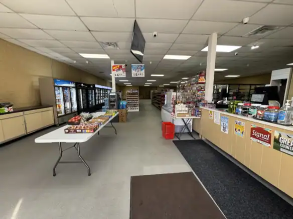 An image showcasing a retail store interior featuring various products, with a focus on the Cordura RE fabric used in outdoor and tactical gear displays.