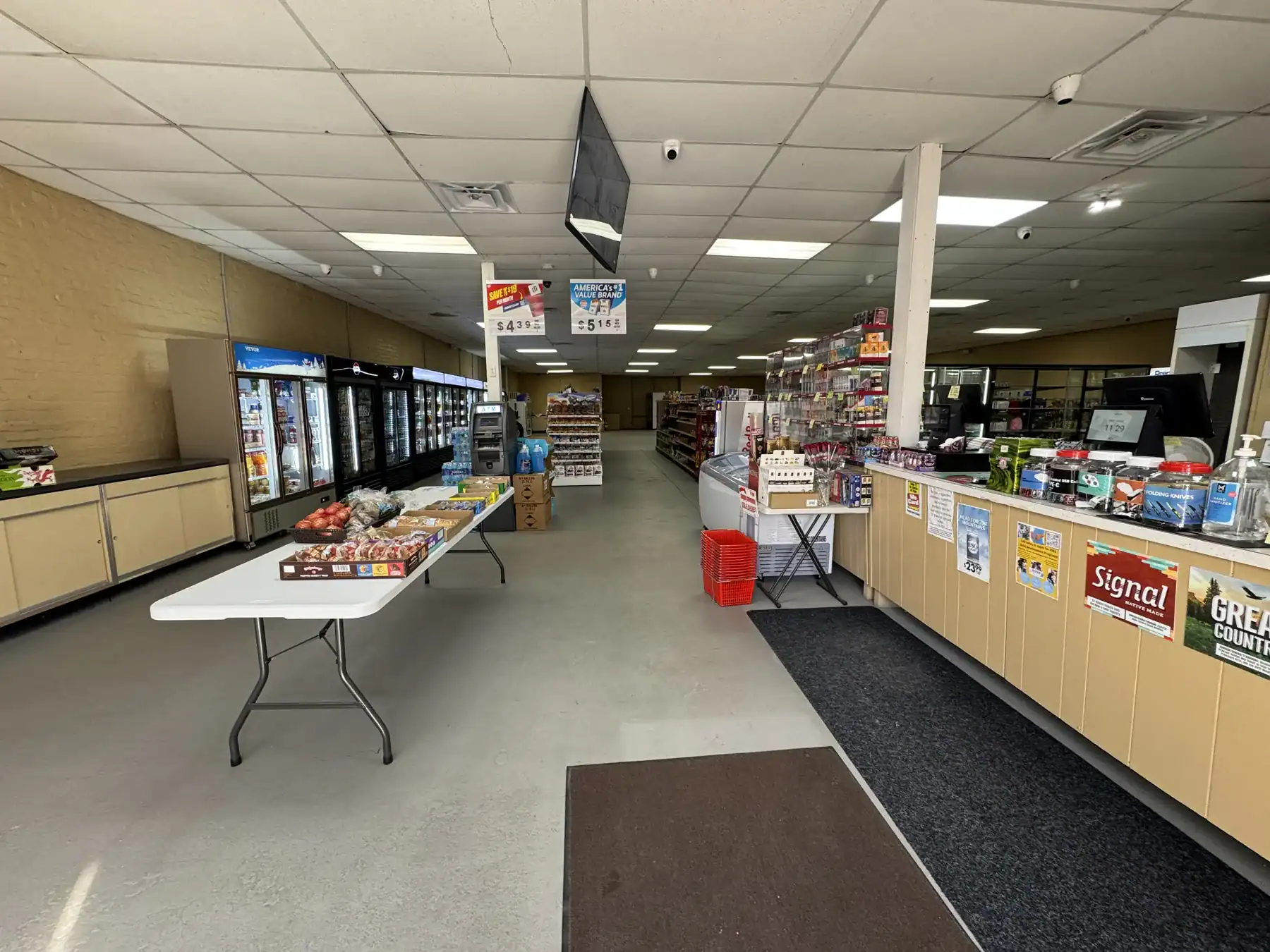An image showcasing a retail store interior featuring various products, with a focus on the Cordura RE fabric used in outdoor and tactical gear displays.