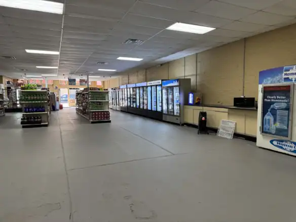 Interior view of a retail store showcasing various vending machines and refrigerators, highlighting the use of durable Cordura RE fabrics for commercial applications.